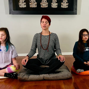 woman and children meditating
